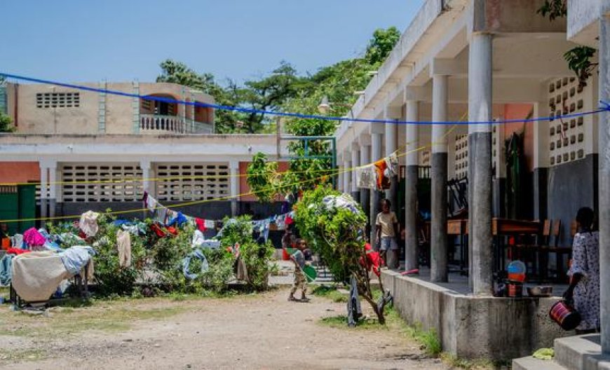 Desks become beds as Haitian school shelters people displaced by violence
